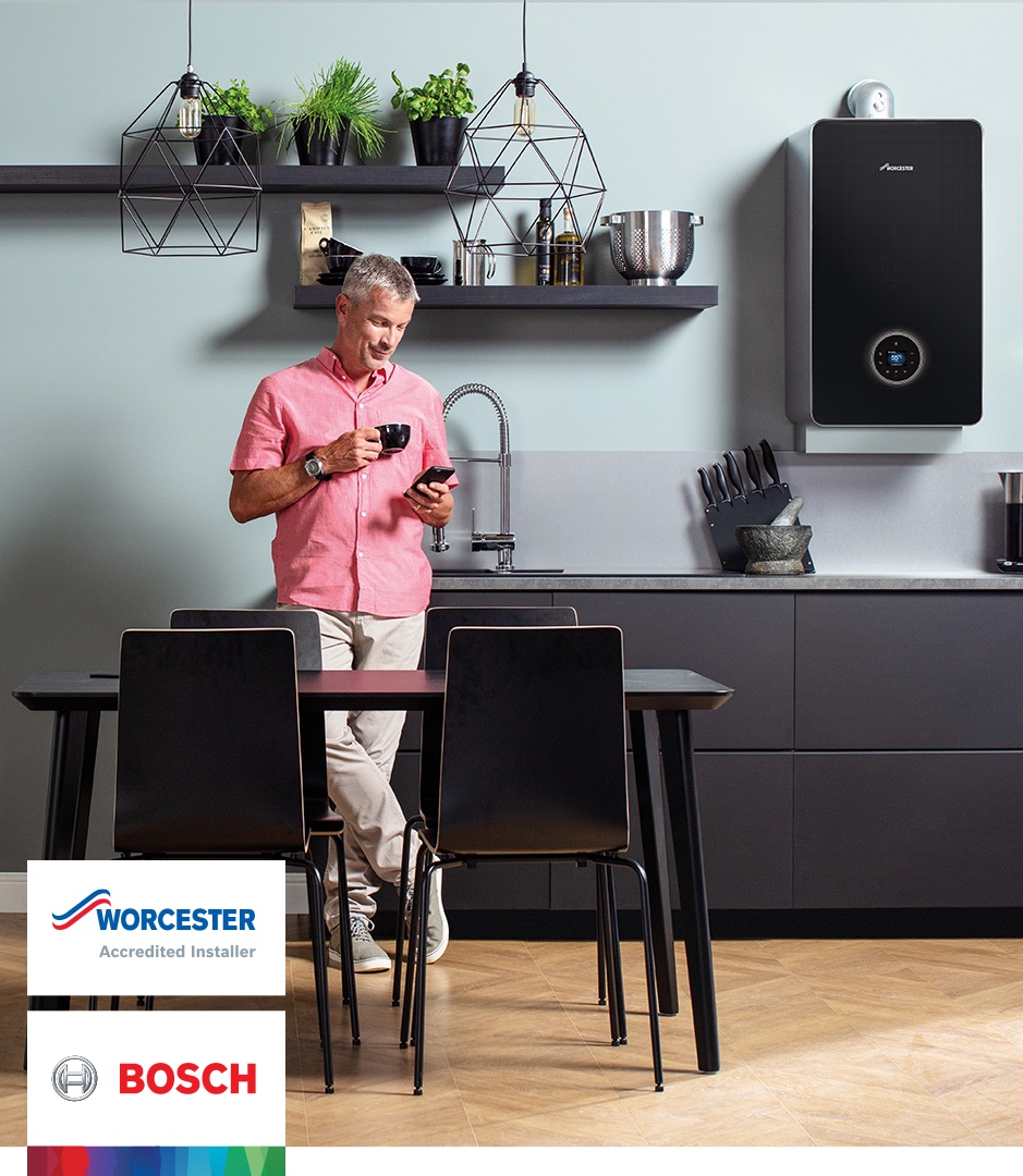 Worcester Bosch advert man in kitchen on phone